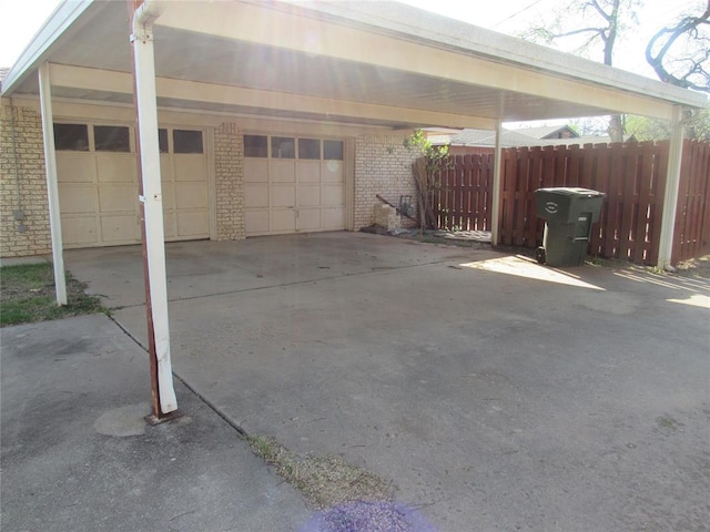 515 W Tennessee Ave, Pauls Valley, OK 73075 - view of car parking with a carport, driveway, and an attached garage