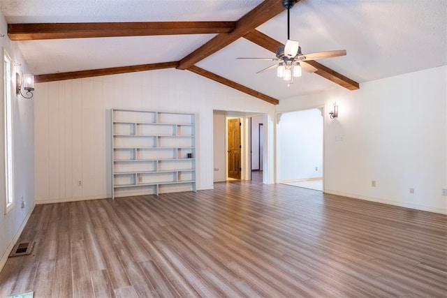 515 W Tennessee Ave, Pauls Valley, OK 73075 - empty room with a ceiling fan, wood finished floors, and baseboards