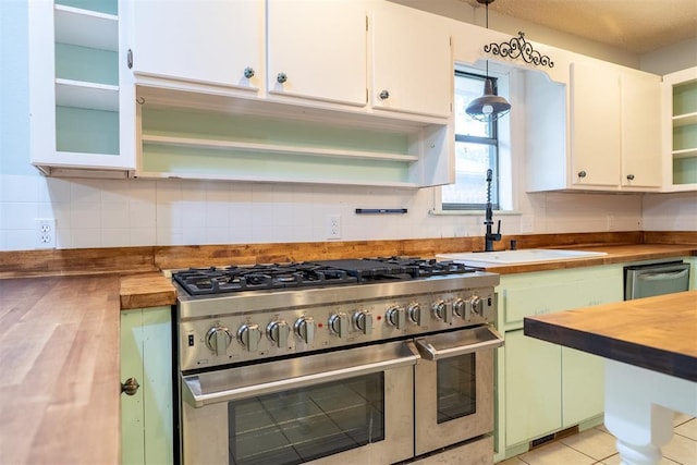 515 W Tennessee Ave, Pauls Valley, OK 73075 - kitchen featuring stainless steel appliances, butcher block counters, open shelves, and decorative backsplash