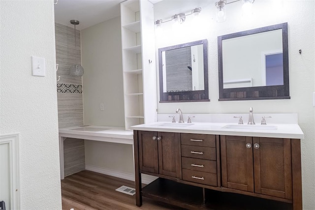 515 W Tennessee Ave, Pauls Valley, OK 73075 - full bath featuring double vanity and wood finished floors