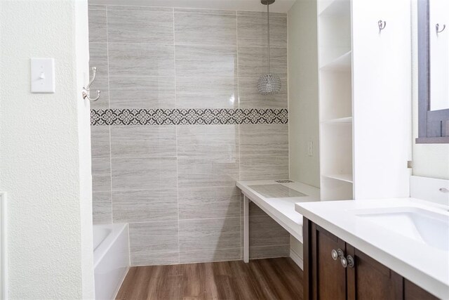 515 W Tennessee Ave, Pauls Valley, OK 73075 - full bath featuring vanity, wood finished floors, and  shower combination