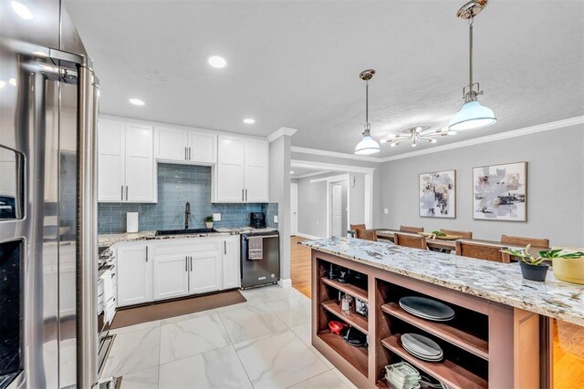 2736 Pembroke Ter, Oklahoma City, OK 73116 - kitchen featuring open shelves, freestanding refrigerator, dishwashing machine, and a sink