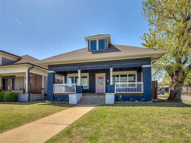 1629 N Klein Ave, Oklahoma City, OK 73106 - bungalow-style house with a shingled roof, covered porch, and a front lawn