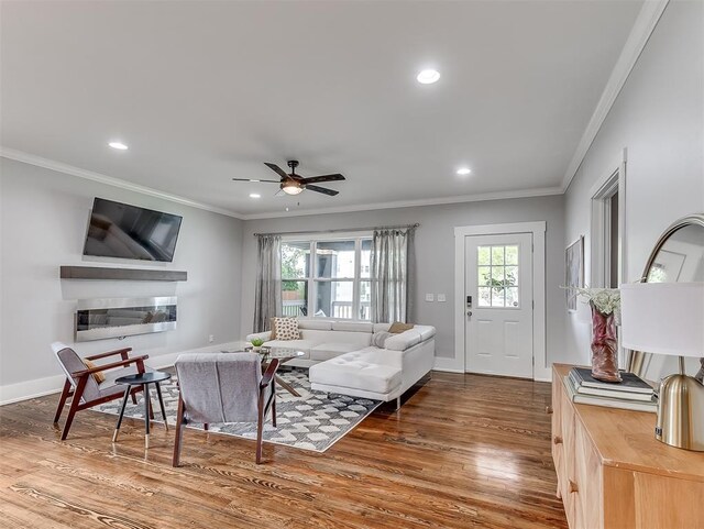 1629 N Klein Ave, Oklahoma City, OK 73106 - living area with recessed lighting, ornamental molding, a ceiling fan, and wood finished floors