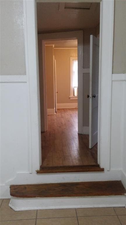 corridor featuring wood finished floors