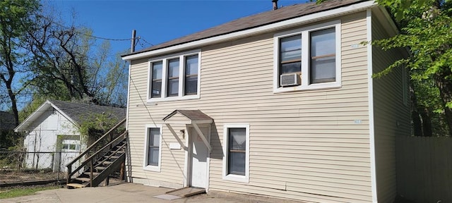 exterior space featuring fence and stairway