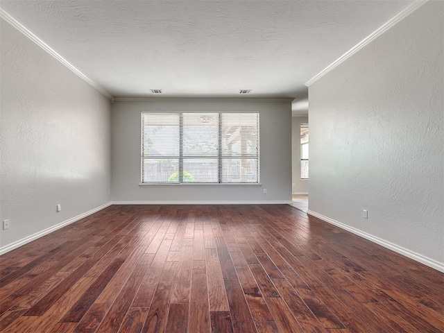 unfurnished living room with baseboards, crown molding, hardwood / wood-style floors, and visible vents