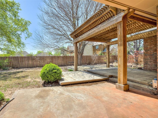 view of patio / terrace with a fenced backyard and a deck