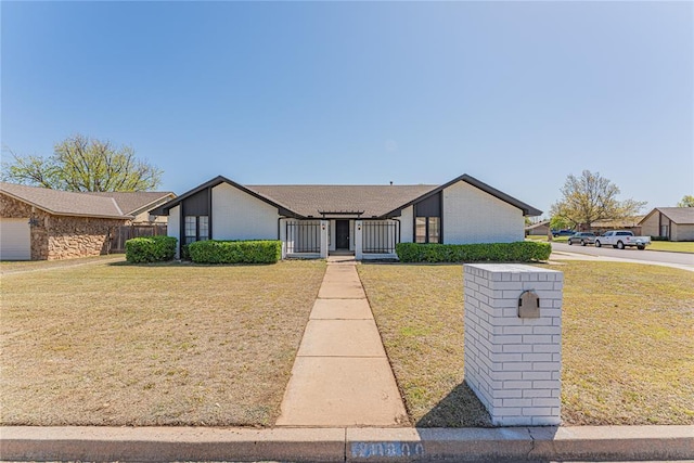11800 Shasta Ln, Oklahoma City, OK 73162 - mid-century inspired home featuring a front yard and fence