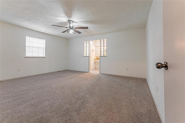 11800 Shasta Ln, Oklahoma City, OK 73162 - carpeted spare room with ceiling fan, baseboards, and a textured ceiling