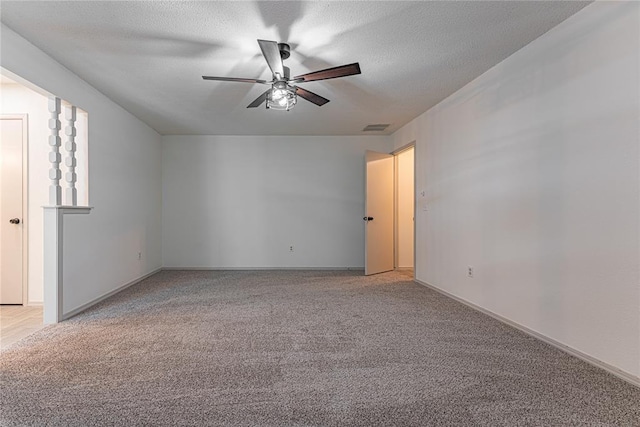 11800 Shasta Ln, Oklahoma City, OK 73162 - spare room featuring a textured ceiling, light colored carpet, a ceiling fan, and visible vents
