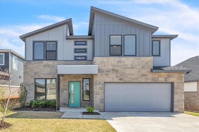 508 NW 175th St, Edmond, OK 73012 - modern home featuring stone siding, an attached garage, board and batten siding, concrete driveway, and a front lawn