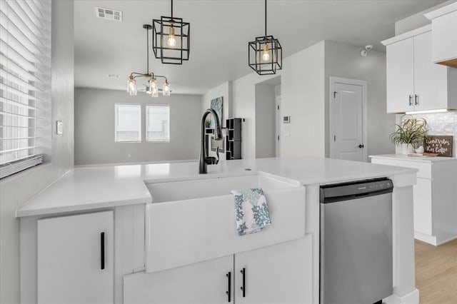 508 NW 175th St, Edmond, OK 73012 - kitchen with dishwashing machine, a sink, light countertops, and decorative light fixtures