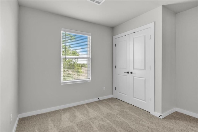 508 NW 175th St, Edmond, OK 73012 - unfurnished bedroom with carpet floors, baseboards, and a closet