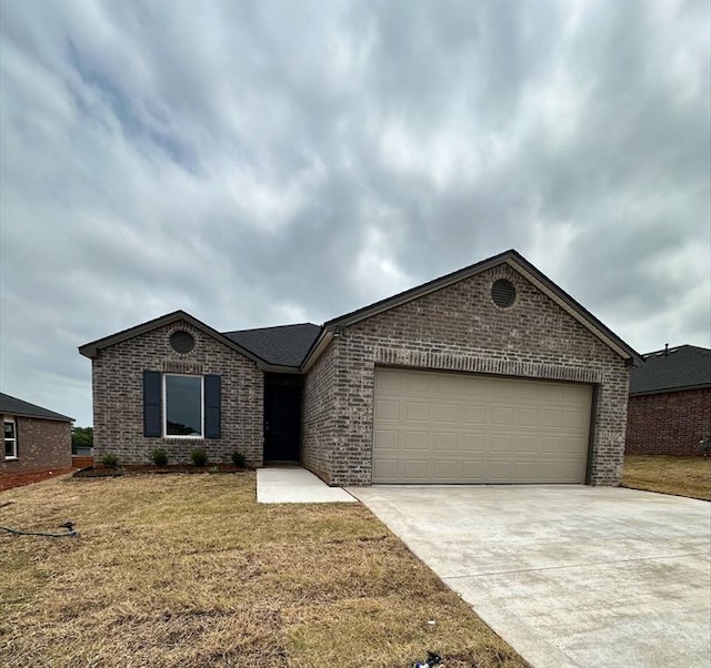 794 SW 11th St, Newcastle, OK 73065 - single story home with brick siding, driveway, an attached garage, and a front lawn