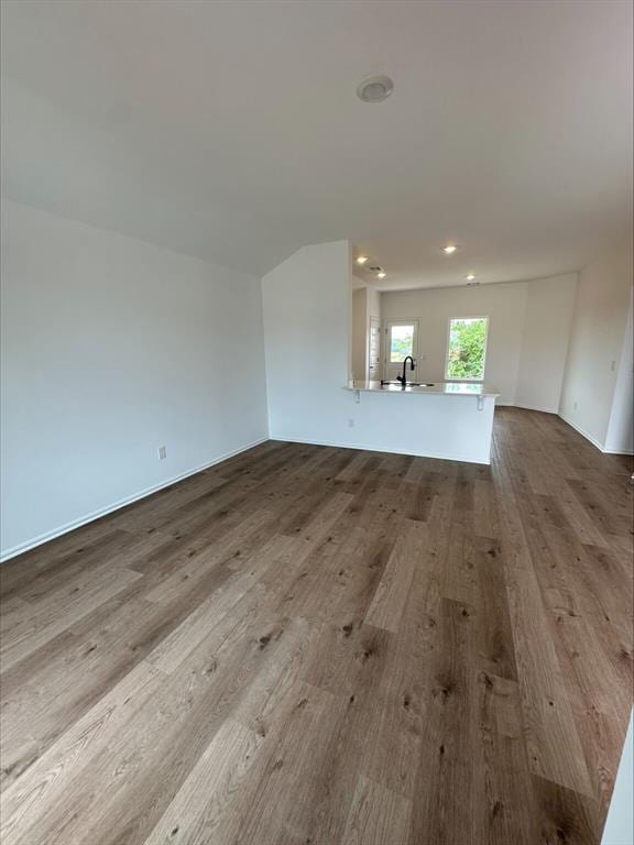 794 SW 11th St, Newcastle, OK 73065 - unfurnished living room featuring a sink, wood finished floors, and recessed lighting