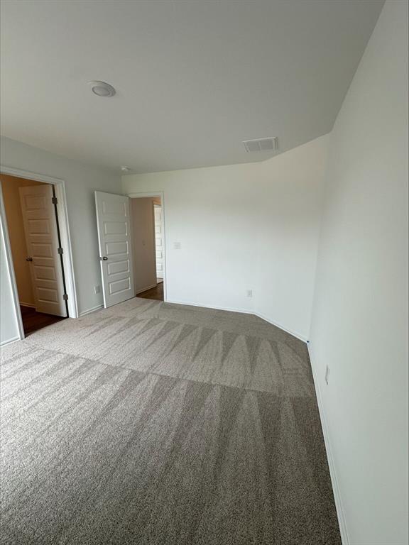 794 SW 11th St, Newcastle, OK 73065 - unfurnished bedroom with dark colored carpet and baseboards