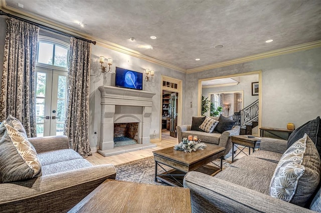 5100 Wisteria Dr, Oklahoma City, OK 73142 - living area featuring a large fireplace, ornamental molding, wood finished floors, french doors, and baseboards