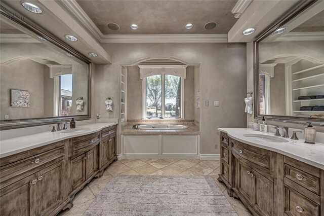 5100 Wisteria Dr, Oklahoma City, OK 73142 - bathroom with two vanities, a sink, and a wealth of natural light