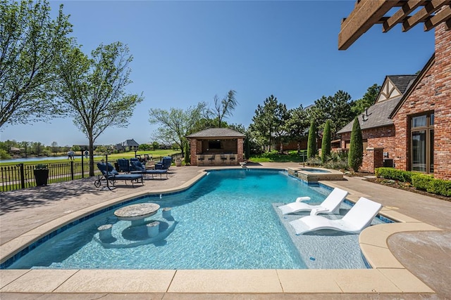 5100 Wisteria Dr, Oklahoma City, OK 73142 - view of pool featuring a diving board, a fireplace, a patio area, a pool with connected hot tub, and fence