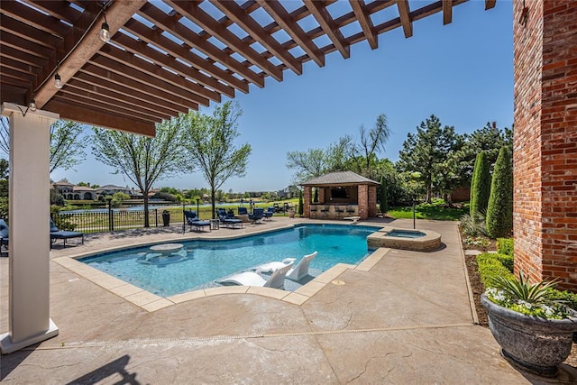 5100 Wisteria Dr, Oklahoma City, OK 73142 - view of swimming pool with a pergola, a patio area, a pool with connected hot tub, a gazebo, and fence