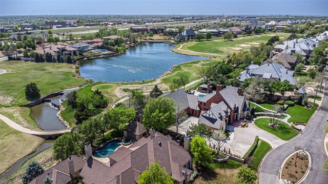 5100 Wisteria Dr, Oklahoma City, OK 73142 - birds eye view of property featuring golf course view, a residential view, and a water view