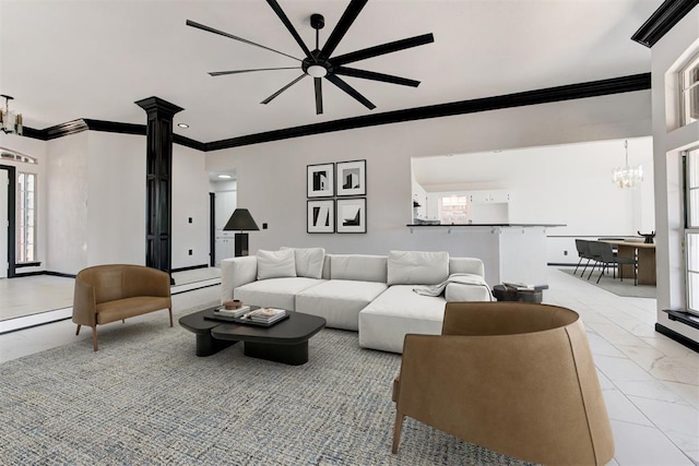 living room with ornamental molding, marble finish floor, and ceiling fan with notable chandelier