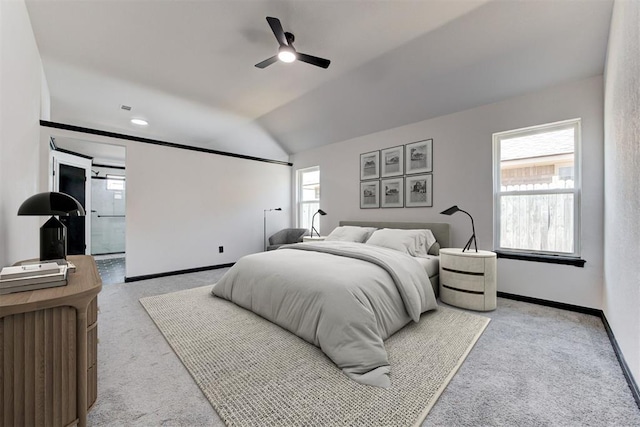 carpeted bedroom featuring ceiling fan, vaulted ceiling, and baseboards