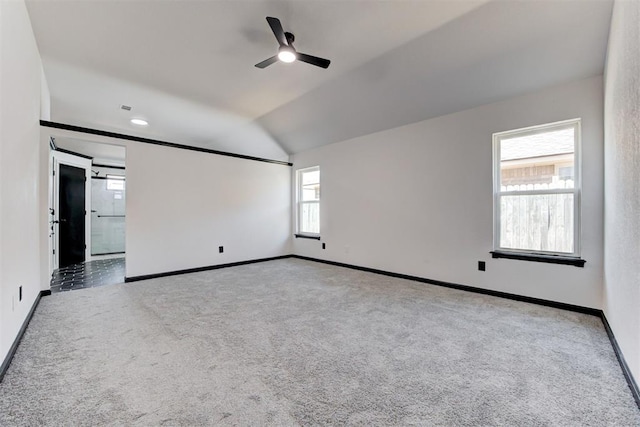 spare room featuring a ceiling fan, carpet flooring, and baseboards