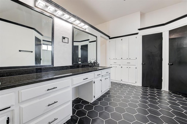 bathroom featuring tile patterned floors and vanity