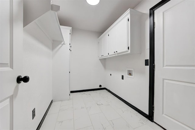 clothes washing area with cabinet space, hookup for an electric dryer, marble finish floor, washer hookup, and baseboards