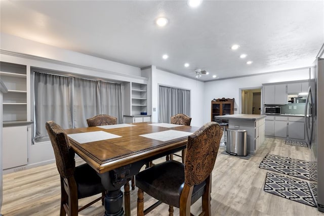dining area featuring recessed lighting and light wood-style floors