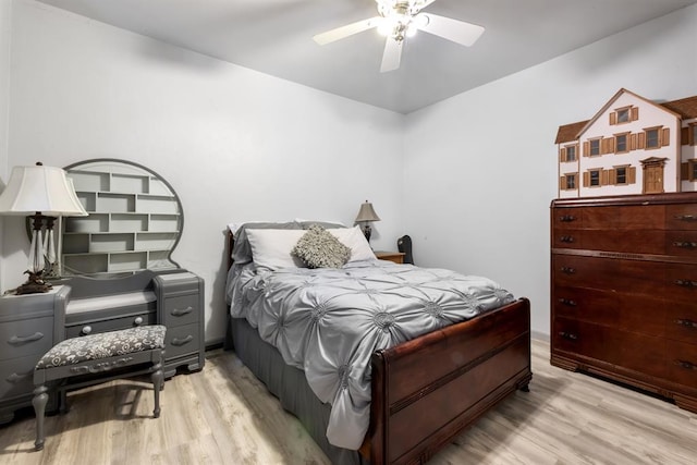 bedroom with light wood finished floors and a ceiling fan