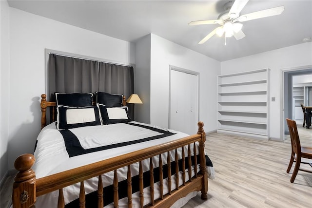 bedroom with ceiling fan and light wood-type flooring