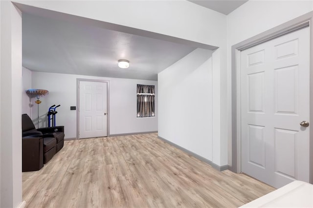 entryway featuring light wood-type flooring and baseboards