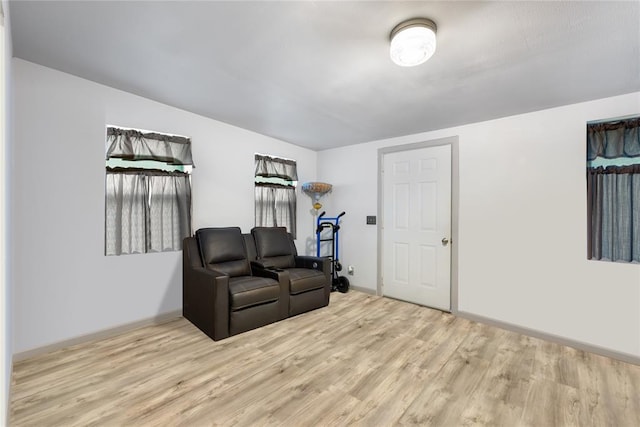 sitting room with wood finished floors and baseboards