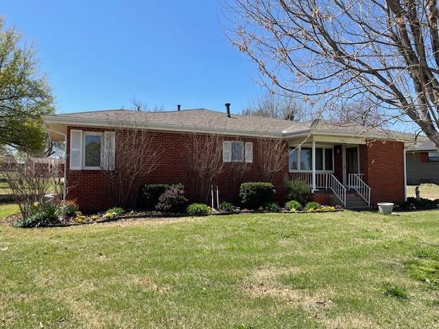 401 Memorial Dr, Okarche, OK 73762 - single story home featuring brick siding and a front lawn