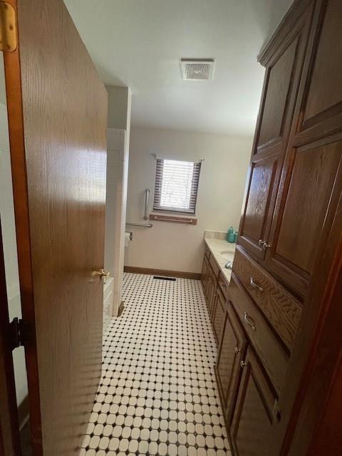 401 Memorial Dr, Okarche, OK 73762 - bathroom featuring visible vents, baseboards, vanity, and tile patterned floors