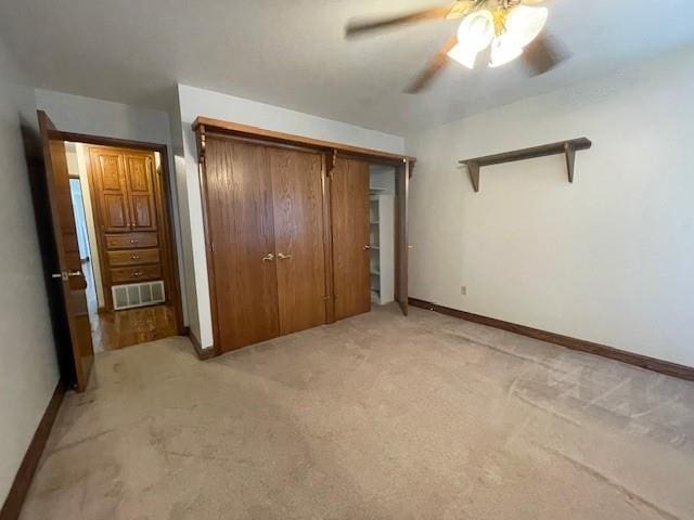 401 Memorial Dr, Okarche, OK 73762 - unfurnished bedroom featuring visible vents, baseboards, and light carpet