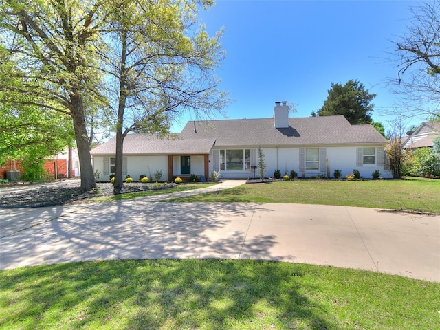 1804 Guilford Ln, Nichols Hills, OK 73120 - single story home featuring a front yard and a chimney