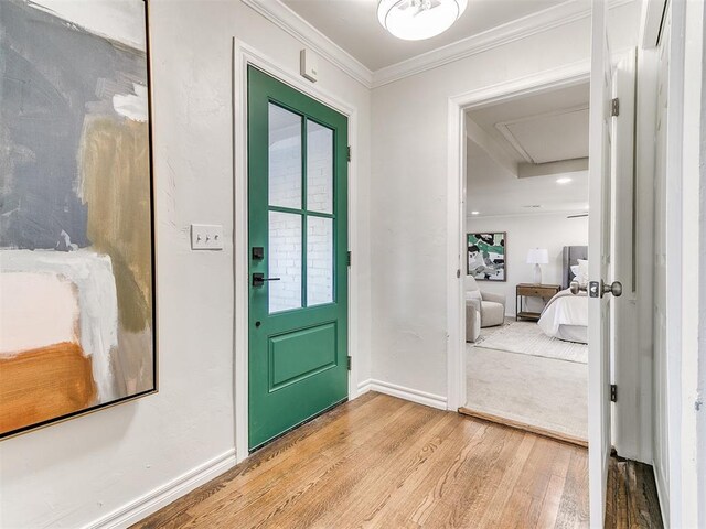 1804 Guilford Ln, Nichols Hills, OK 73120 - entryway with light wood-type flooring, crown molding, and baseboards
