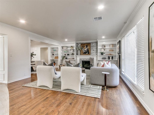 1804 Guilford Ln, Nichols Hills, OK 73120 - living area featuring ornamental molding, a large fireplace, visible vents, and a wealth of natural light