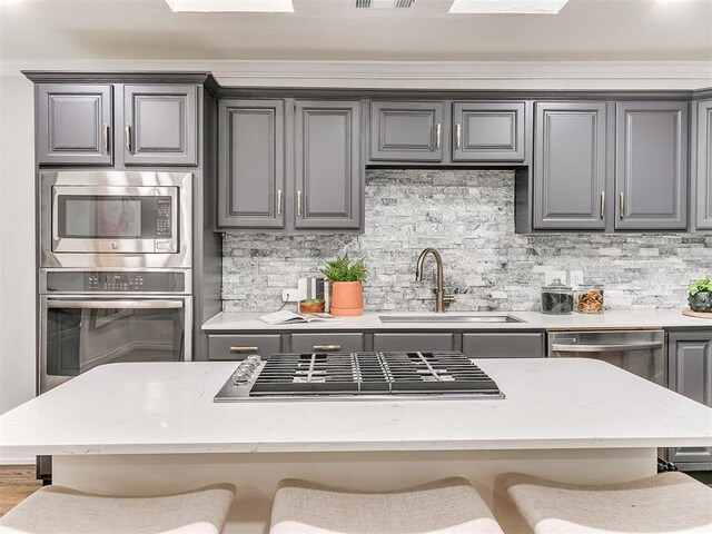 1804 Guilford Ln, Nichols Hills, OK 73120 - kitchen with gray cabinets, a sink, and stainless steel appliances