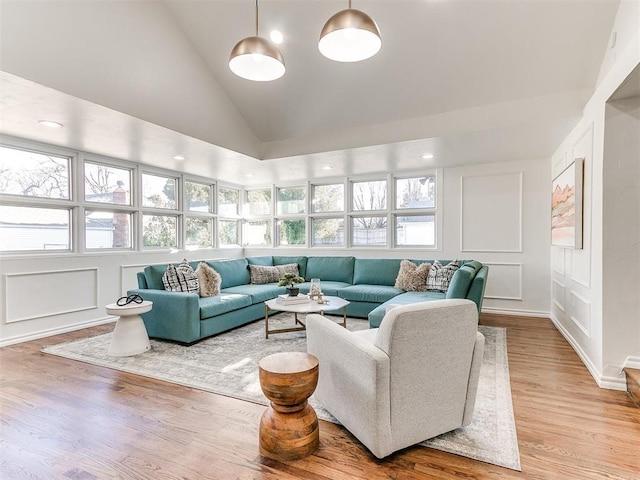 1804 Guilford Ln, Nichols Hills, OK 73120 - living room with a decorative wall, light wood-style flooring, and vaulted ceiling
