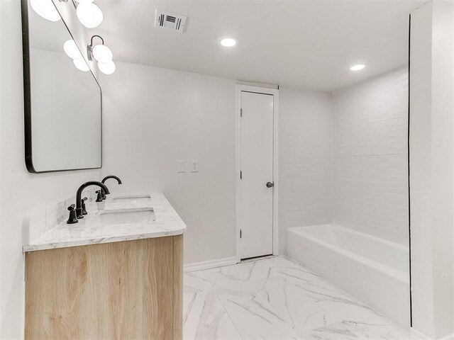 1804 Guilford Ln, Nichols Hills, OK 73120 - bathroom featuring a tub to relax in, visible vents, marble finish floor, a sink, and double vanity