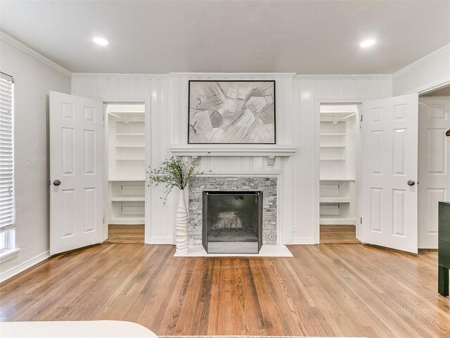 1804 Guilford Ln, Nichols Hills, OK 73120 - unfurnished living room featuring a fireplace with flush hearth, light wood-type flooring, ornamental molding, recessed lighting, and baseboards