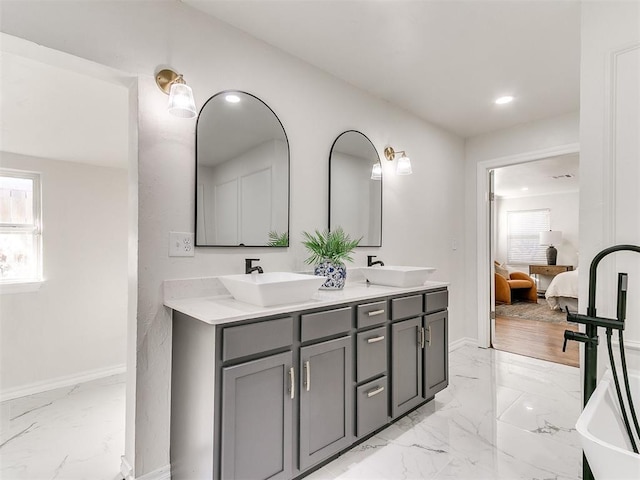 1804 Guilford Ln, Nichols Hills, OK 73120 - bathroom featuring a sink, ensuite bathroom, double vanity, and marble finish floor