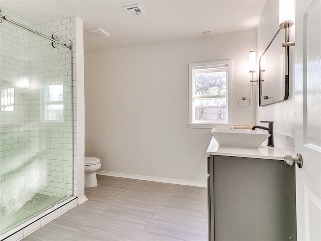 1804 Guilford Ln, Nichols Hills, OK 73120 - full bathroom with visible vents, toilet, a stall shower, and vanity