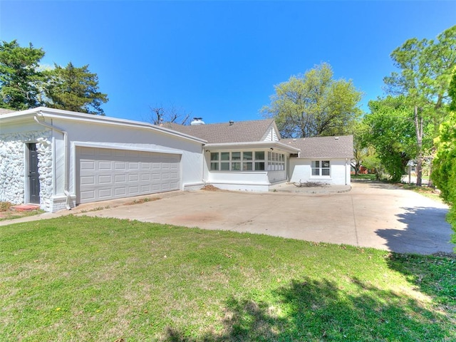 1804 Guilford Ln, Nichols Hills, OK 73120 - ranch-style house featuring a front yard, driveway, a sunroom, and a garage