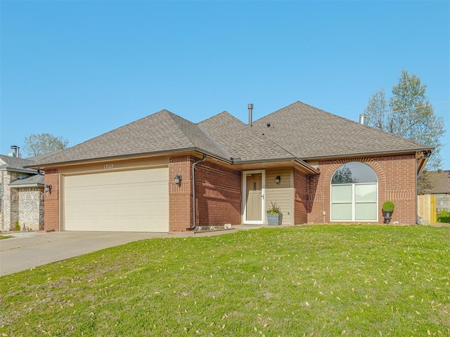 single story home featuring a garage, a front yard, brick siding, a shingled roof, and driveway